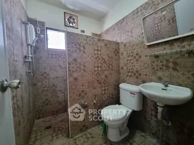 Charming bathroom with intricate tile design and modern fixtures