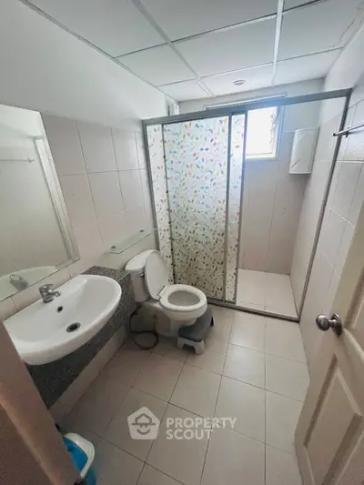 Compact bathroom with shower and modern fixtures