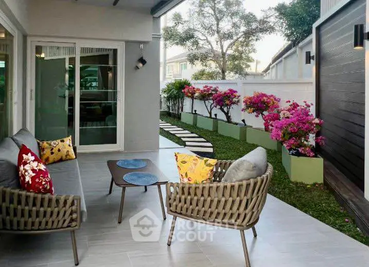 Charming patio with stylish seating and vibrant garden view