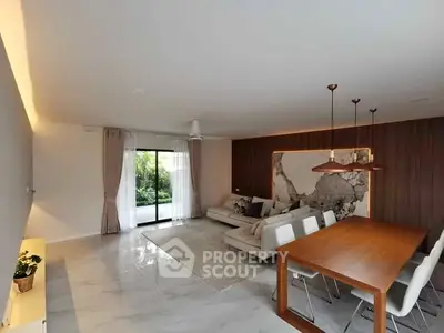 Modern living room with elegant dining area and garden view