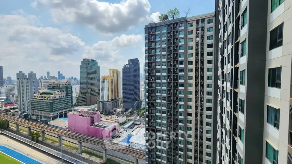 Stunning cityscape view from high-rise building showcasing urban skyline and modern architecture.