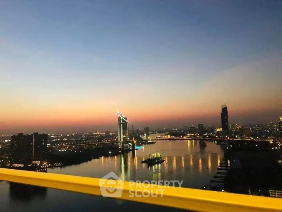 Stunning cityscape view at dusk with iconic skyline and waterfront reflections.