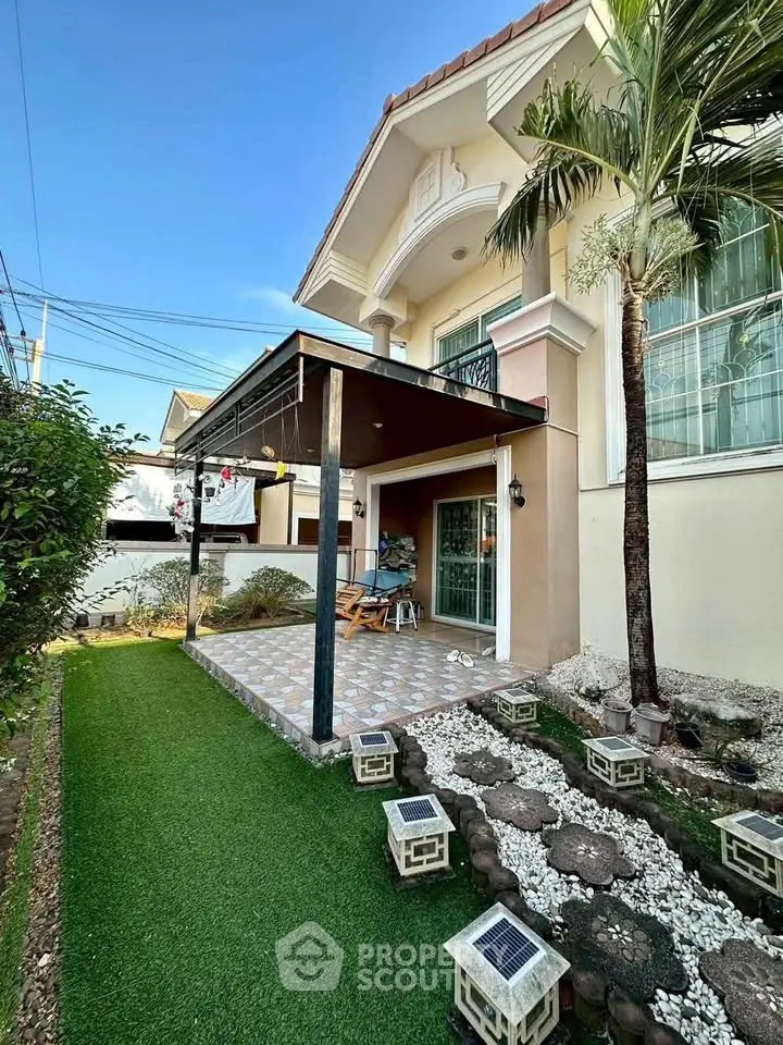 Charming suburban home with lush garden and inviting patio area