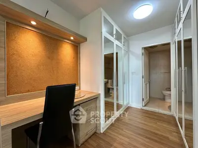 Modern study room with built-in desk and mirrored closet doors