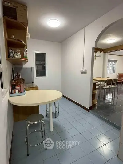 Cozy kitchen with open layout and dining area, perfect for family gatherings.