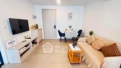 Cozy living room with modern decor and dining area, perfect for relaxation and entertaining.