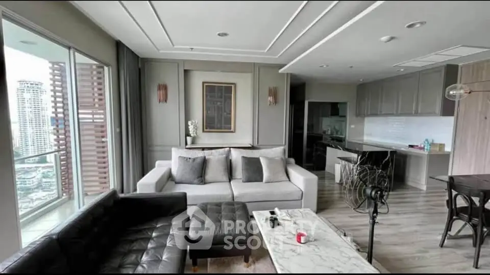 Modern living room with elegant decor and city view balcony