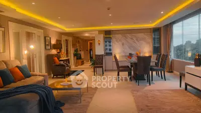 Luxurious open-plan living and dining area with modern decor and ambient lighting.