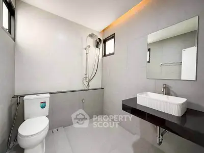 Modern minimalist bathroom with sleek fixtures and spacious layout