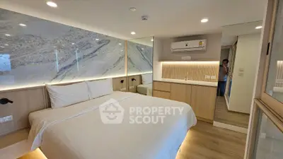 Luxurious modern bedroom with elegant design and ambient lighting