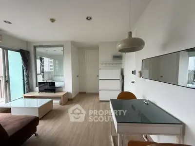 Modern living room with sleek furniture and natural light in urban apartment