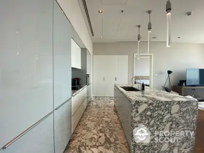 Sleek modern kitchen with marble countertops and state-of-the-art appliances, perfect for culinary enthusiasts seeking a luxurious cooking space.