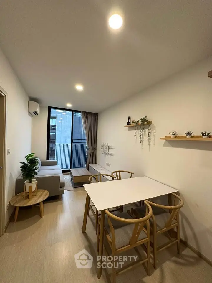 Modern living room with stylish furniture and balcony view