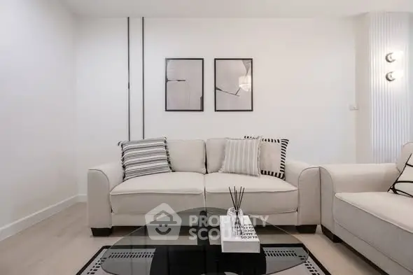 Modern living room with stylish decor and comfortable seating in a contemporary apartment.
