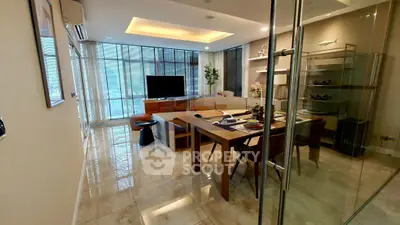 Spacious modern living room with elegant dining area and large windows