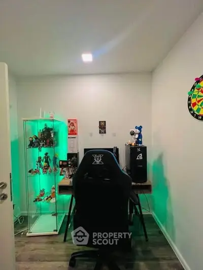 Modern study room with gaming chair and display cabinet