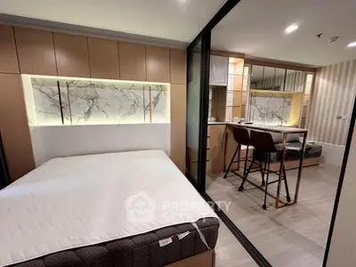 Modern bedroom with stylish decor and cozy ambiance, featuring a comfortable bed and elegant lighting.