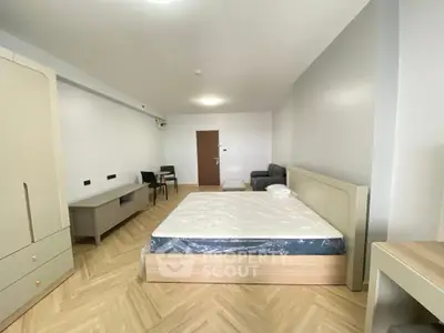 Spacious modern bedroom with minimalist design and natural light