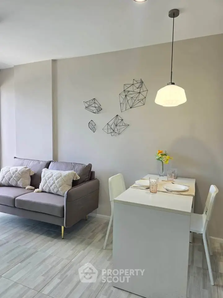 Modern living room with cozy sofa and stylish dining area