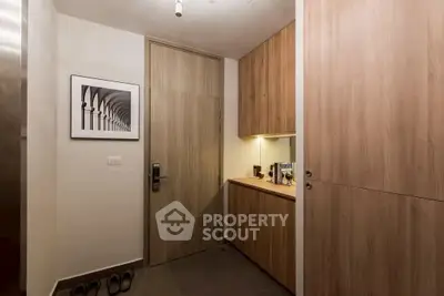 Stylish modern entryway with wooden cabinets and sleek design
