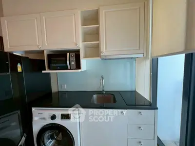 Modern kitchen with sleek appliances and ample storage space