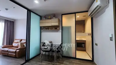 Modern apartment interior with open layout, featuring a cozy living area and stylish kitchen.