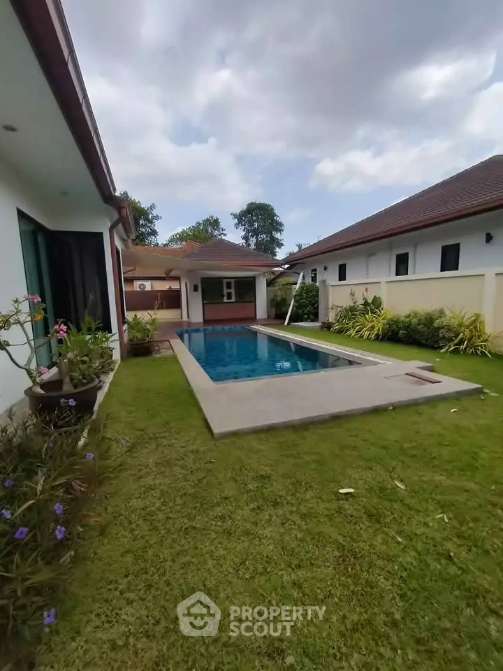 Luxurious villa with private pool and lush garden, perfect for relaxation and entertaining.