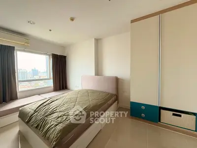 Modern bedroom with city view and built-in storage in high-rise apartment