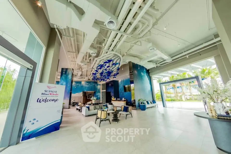 Luxurious modern lobby with artistic ceiling and elegant seating area