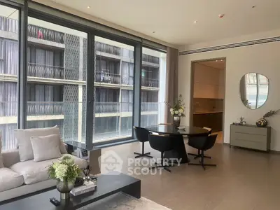 Luxurious modern living room with elegant dining area and large windows