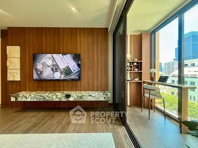 Luxurious modern living room with large windows and city view, featuring elegant decor and a cozy study nook.