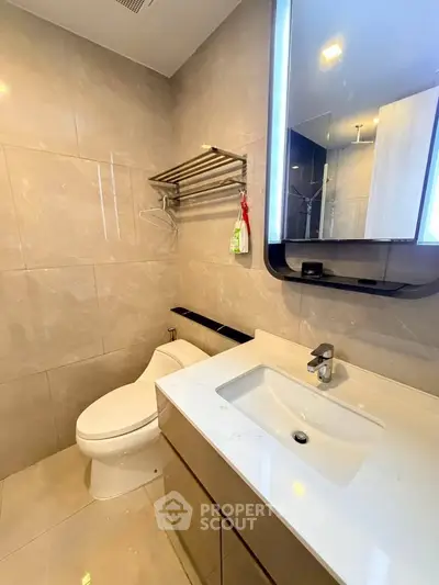 Modern bathroom with sleek fixtures and elegant tile design