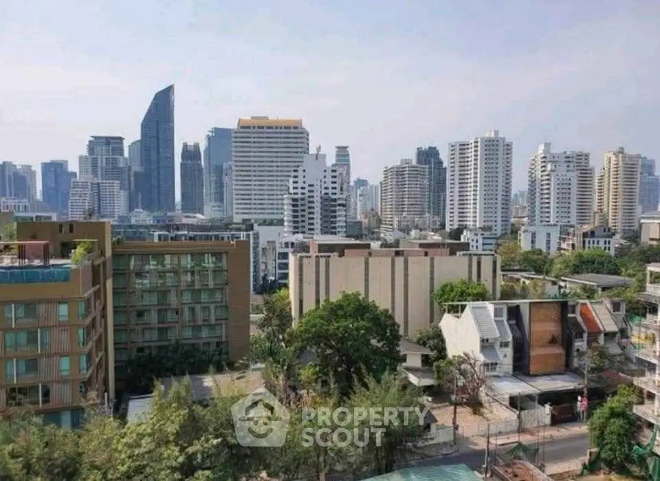 Stunning cityscape view showcasing modern high-rise buildings and lush greenery in a vibrant urban setting.