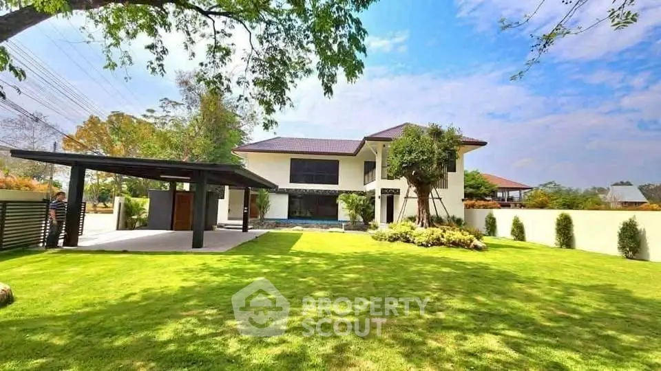 Stunning modern home with lush garden and spacious outdoor area, perfect for family living.