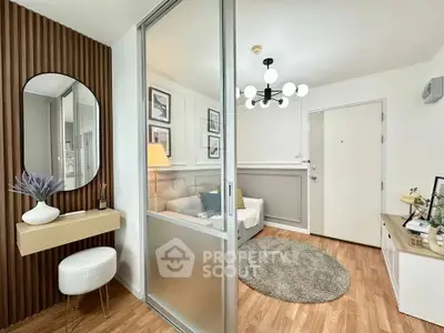 Modern living room with stylish decor and wooden flooring, featuring a cozy seating area and contemporary lighting.