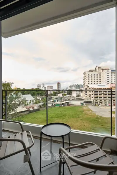 Spacious balcony with city view, perfect for relaxation and enjoying urban scenery.