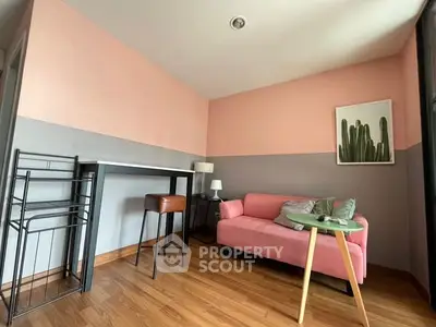 Chic and cozy living room with pink sofa and modern decor