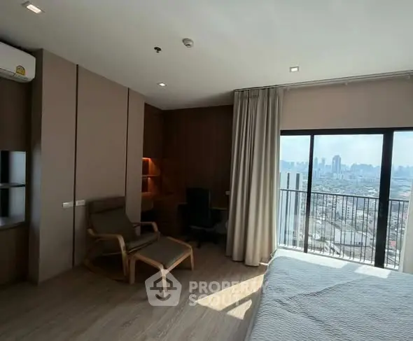 Spacious bedroom with city view and modern furnishings