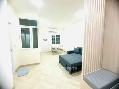 Modern living room with sleek design and comfortable seating in a bright, airy space.