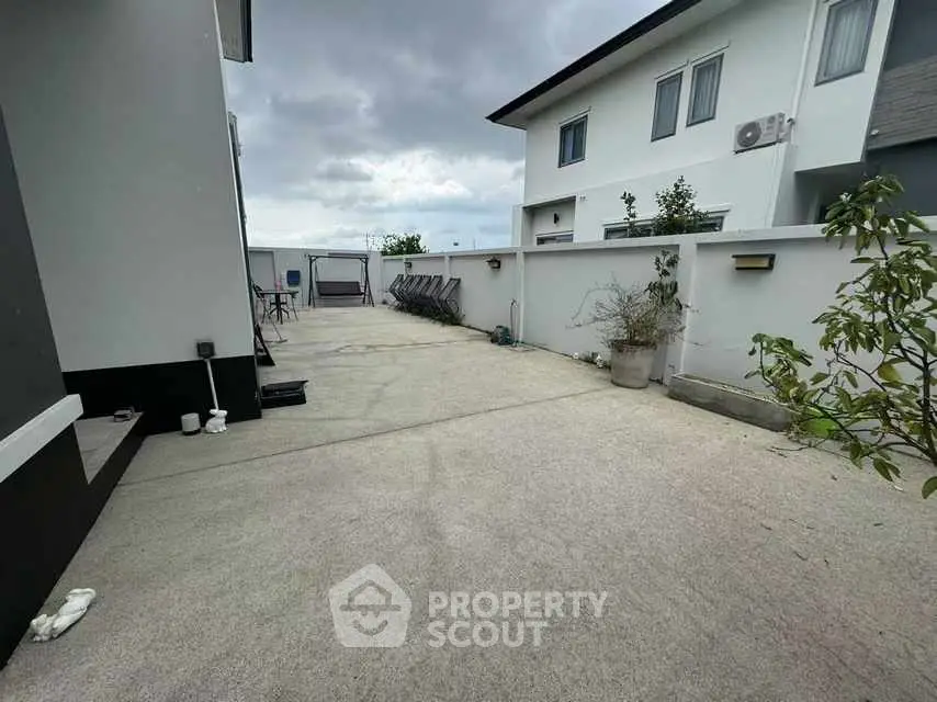 Spacious outdoor area with modern exterior design and ample space for activities.