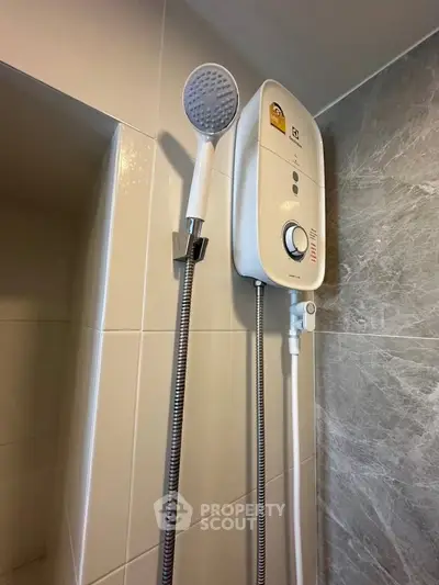 Modern bathroom with sleek shower unit and stylish tile design.