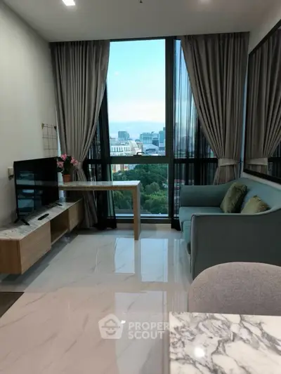 Modern living room with city view, sleek furniture, and elegant marble flooring.