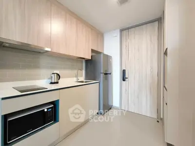 Modern kitchen with sleek cabinetry and stainless steel appliances