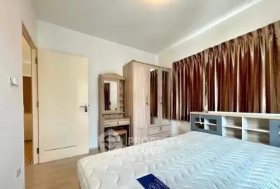 Spacious bedroom with elegant wooden furniture and ample natural light
