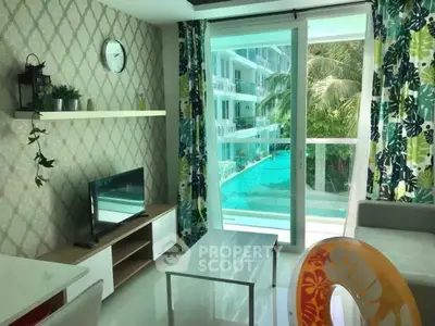 Stylish living room with pool view, modern decor, and vibrant curtains in a luxury apartment.
