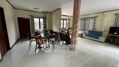 Spacious living room with dining area and modern decor