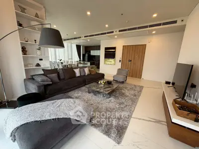 Luxurious modern living room with elegant decor and open kitchen layout