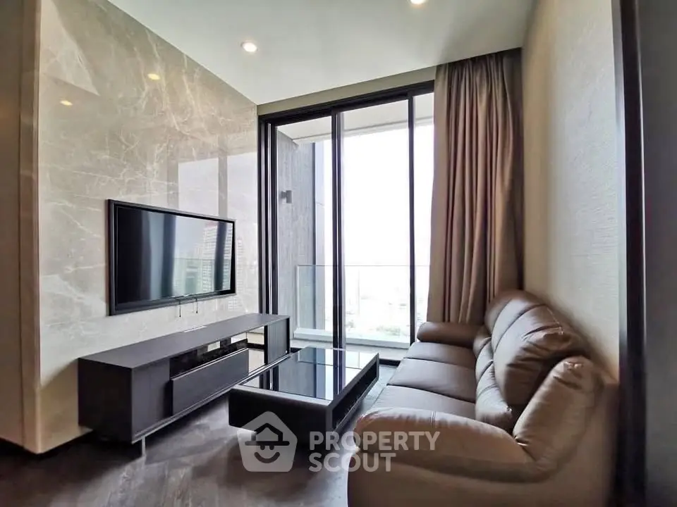 Luxurious living room with modern decor and large windows offering stunning views.