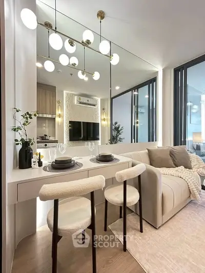 Modern living room with elegant dining area and stylish decor in a contemporary apartment.