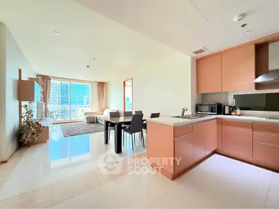 Spacious open-plan living room and kitchen with modern design and natural light